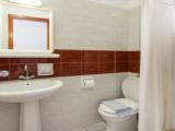 Standard Triple room with partial sea view