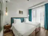 Deluxe Twin room with partial ocean view