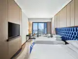 Deluxe High Floor Twin room with partial ocean view