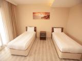 Standard Triple room with balcony and with partial sea view