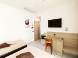 Standard Quadruple room with courtyard view