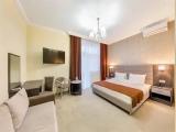 Deluxe Quadruple room with balcony
