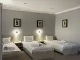 Deluxe Triple room with courtyard view