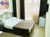 Deluxe Triple room with balcony and beachfront