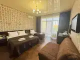 Deluxe Triple room with balcony and with pool view
