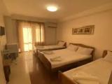 Standard Quadruple Family room with balcony and with courtyard view