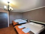 Deluxe Quadruple room with balcony and with city view