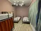 Bed in Dorm with courtyard view
