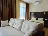 Deluxe Quadruple room with balcony