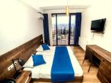 Standard Triple room with balcony and with city view