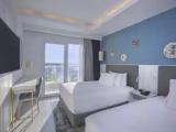 Deluxe Quadruple room with partial sea view