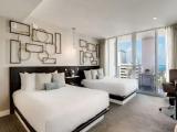 Quadruple room with balcony and with partial ocean view