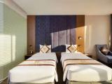 Deluxe Quadruple room with partial sea view