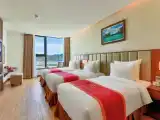 Deluxe Triple room with partial sea view