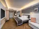 Deluxe Family Suite with side sea and pool view