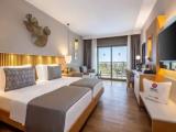Deluxe (2 adults + 2 children) room with side sea view
