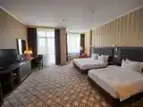 Deluxe Triple Family Suite with balcony and with city view