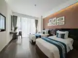 Deluxe Twin room with city view and partial sea view