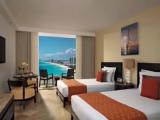 Deluxe Quadruple room with balcony and oceanfront