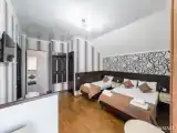 Deluxe Quadruple room with balcony