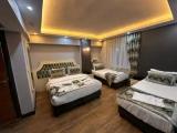 Standard Quadruple room with garden view