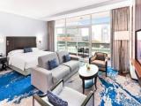 Family with sofa bed room with sea view