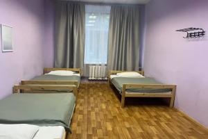 Krovat v tryohmestnom nomere ekonom-klassa Apartments, Dzerzhinsk