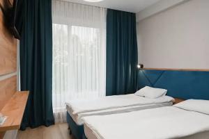 Dvuhmestnyy nomer s 2 otdelnymi krovatyami standart twin Apartments, Jefremow