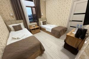 Dvuhmestnyy nomer s 2 otdelnymi krovatyami standart Apartments, Tashkent