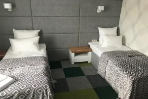 Dvuhmestnyy nomer s 2 otdelnymi krovatyami uluchshennyy Apartments, Rakaw