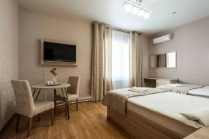 Dvuhmestnyy nomer s 2 otdelnymi krovatyami uluchshennyy standart Apartments, Schekino