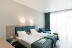 Dvuhmestnyy nomer s 1 krovatyu ili 2 razdelnymi Komfort Apartments, Machara