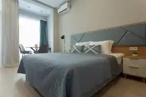 Apartamenty oblako nad volnami, Ashe