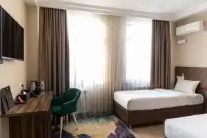 Dvuhmestnyy nomer s 2 otdelnymi krovatyami standart Apartments, Bishkek