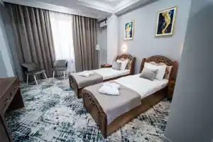 Dvuhmestnyy nomer s 2 otdelnymi krovatyami uluchshennyy Apartments, Tashkent