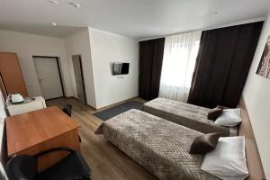 Dvuhmestnyy nomer s 2 otdelnymi krovatyami uluchshennyy Apartments, Yalutorovsk