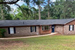 Spacious Fenced Yard and Fun Games - Charming Ranch Retreat Apartments, Tallahassee