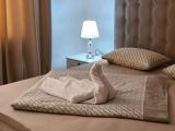 One-Room Superior Suite With A Large Double Bed And Two Armchairs