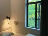 Budget Female Dorm - Double Occupancy, One Bedplace (Bright Window, Shared Bathroom)